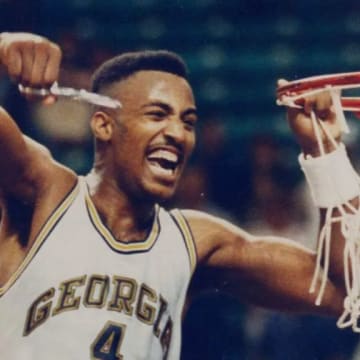 Forward Dennis Scott cuts the net down after beating No. 6 Minnesota to make the 1990 Final Four. 