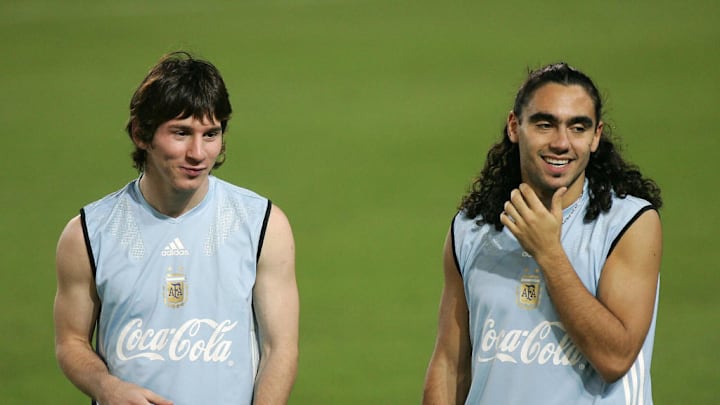 Argentinian players Lionel Messi (L) and