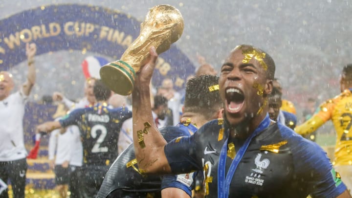 Players from France celebrate the 2018 World Cup title after...