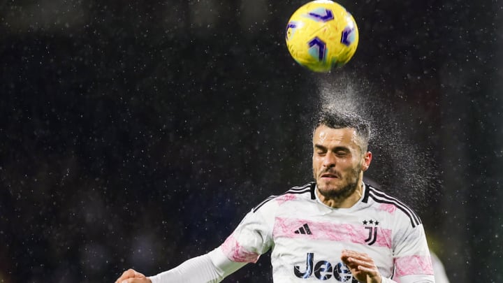 Juventus' Serbian midfielder Filip Kostic heads the ball the...