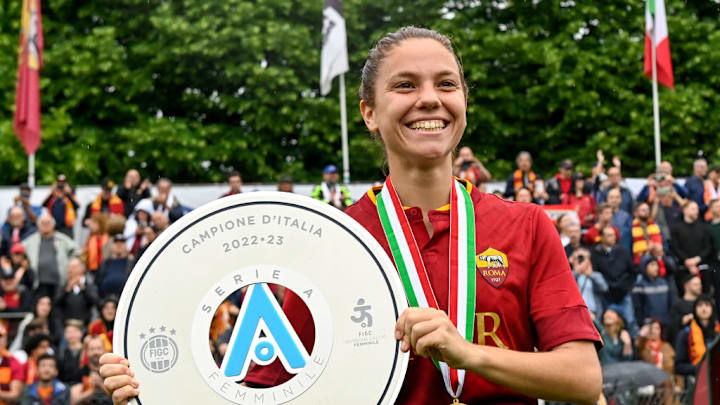Manuela Giugliano of AS Roma holds the trophy as she...