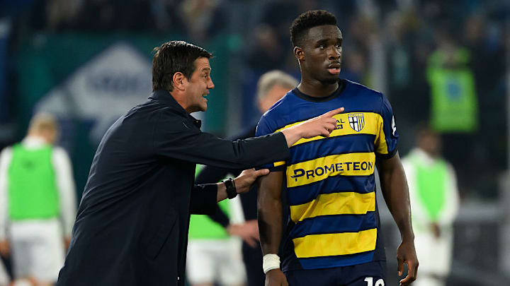 Cristian Chivu, head coach of Parma Calcio, talks with...