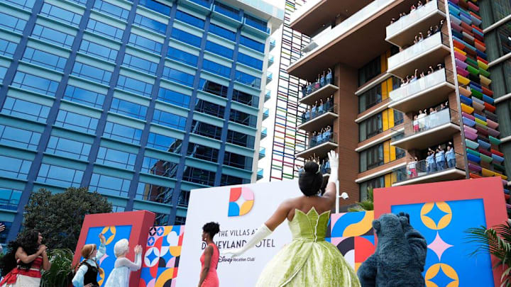 Sep. 28, 2023; Anaheim, Calif., USA; Disney characters and cast members wave at the grand opening of The Villas at Disneyland Hotel. The Villas are located in a brand new fourth tower at Disney   s very first hotel, Disneyland Hotel in Anaheim, California.