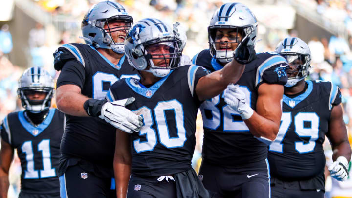 CHARLOTTE, NC - DECEMBER 24: Chuba Hubbard #30 of the Carolina Panthers celebrates a touchdown during an NFL game against the Green Bay Packers at Bank of America Stadium on December 24, 2023 in Charlotte, NC.