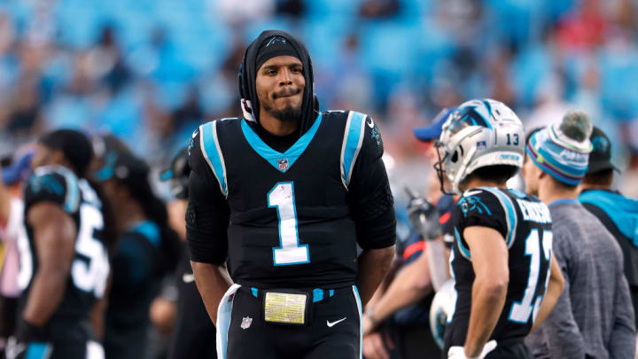 CHARLOTTE, NORTH CAROLINA - DECEMBER 26: Cam Newton #1 of the Carolina Panthers watches from the sideline during the final minute of the team's final home game of the season against the Tampa Bay Buccaneers at Bank of America Stadium on December 26, 2021 in Charlotte, North Carolina.