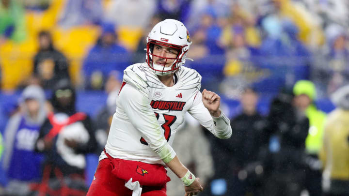 PITTSBURGH, PA - OCTOBER 14: Louisville Cardinals quarterback Jack Plummer (13) throws a pass during the first quarter of the college football game between the Louisville Cardinals and Pitt Panthers on October 14, 2023, at Acrisure Stadium in Pittsburgh, PA.