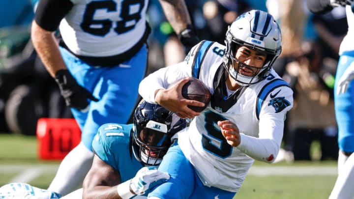 JACKSONVILLE, FL - DECEMBER 31: Defensive End Josh Allen #41 of the Jacksonville Jaguars makes a sack against Quarterback Bryce Young #9 of the Carolina Panthers during the game at EverBank Stadium on December 31, 2023 in Jacksonville, Florida. The Jaguars defeated the Panthers 26 to 0.