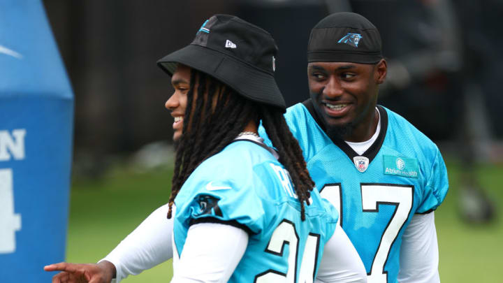 CHARLOTTE, NORTH CAROLINA - JUNE 04: Jonathon Brooks #24 and Xavier Legette #17 of the Carolina Panthers attend Carolina Panthers OTA Offseason Workout on June 04, 2024 in Charlotte, North Carolina.