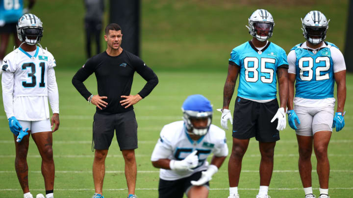 CHARLOTTE, NORTH CAROLINA - JUNE 04: (L-R) Lamar Jackson #31, head coach Dave Canales, Ja'Tavion Sanders #85, and Tommy Tremble #82 watch Kenny Dyson #55 train during Carolina Panthers OTA Offseason Workout on June 04, 2024 in Charlotte, North Carolina.