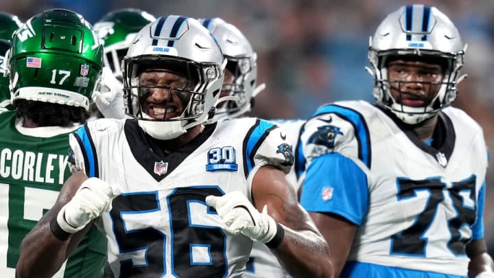 CHARLOTTE, NORTH CAROLINA - AUGUST 17: Trevin Wallace #56 of the Carolina Panthers reacts after a first down play by the New York Jets during the first half of their preseason game at Bank of America Stadium on August 17, 2024 in Charlotte, North Carolina.