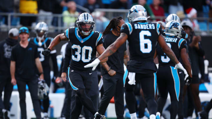 CHARLOTTE, NORTH CAROLINA - DECEMBER 24: Chuba Hubbard #30 of the Carolina Panthers celebrates after Miles Sanders #6 of the Carolina Panthers scores a two point conversion to tie the game during the fourth quarter against the Green Bay Packers at Bank of America Stadium on December 24, 2023 in Charlotte, North Carolina.