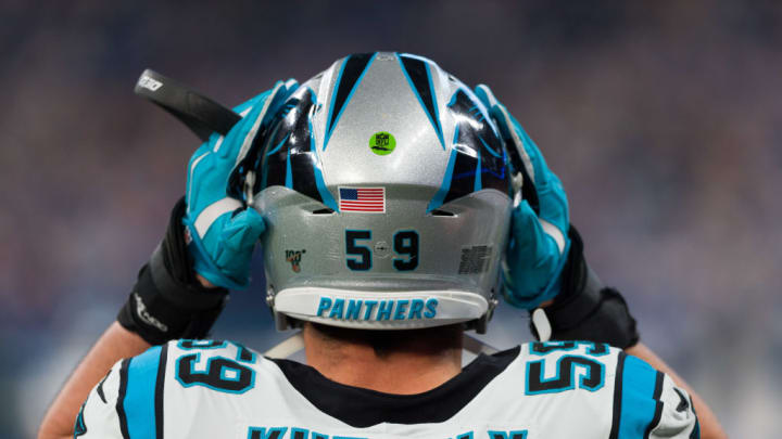 INDIANAPOLIS, IN - DECEMBER 22: Carolina Panthers linebacker Luke Kuechly (59) puts his helmet on during the NFL game between the Carolina Panthers and the Indianapolis Colts on December 22, 2019 at Lucas Oil Stadium, in Indianapolis, IN.