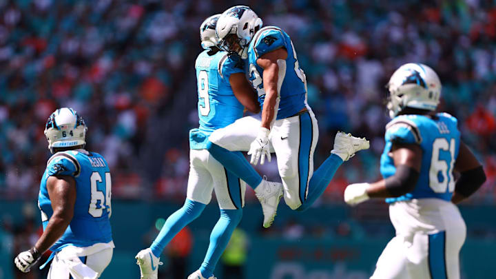 MIAMI GARDENS, FLORIDA - OCTOBER 15: Bryce Young #9 of the Carolina Panthers celebrates a touchdown with Tommy Tremble #82 during the second quarter in the game against the Miami Dolphins at Hard Rock Stadium on October 15, 2023 in Miami Gardens, Florida.