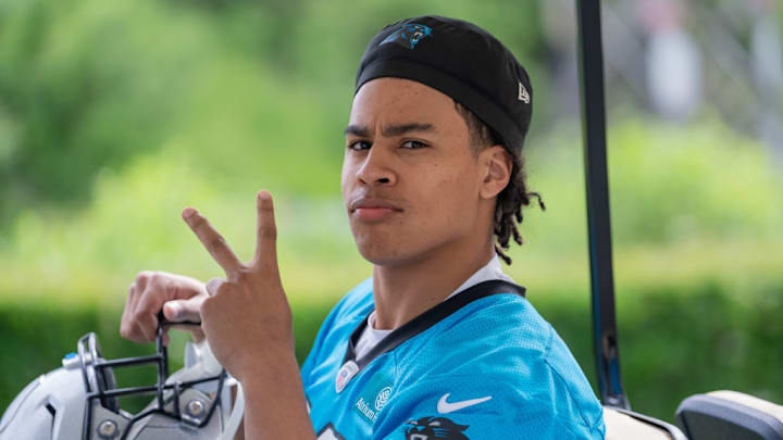 CHARLOTTE, NORTH CAROLINA - MAY 10: Jalen Coker #18 of the Carolina Panthers rides to the field before rookie minicamp on May 10, 2024 in Charlotte, North Carolina. 