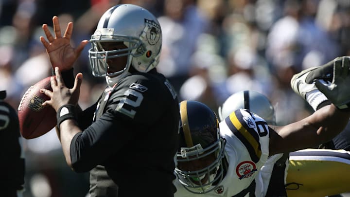 OAKLAND, CA - OCTOBER 25: JaMarcus Russell #2 of the Oakland Raiders fumbles the ball as he is rushed by Calvin Pace #97 of the New York Jets during an NFL game at the Oakland-Alameda County Coliseum on October 25, 2009 in Oakland, California.