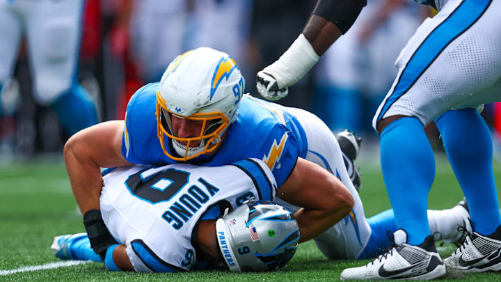 CHARLOTTE, NC - SEPTEMBER 15: Joey Bosa #97 of the Los Angeles Chargers sacks Bryce Young #9 of the Carolina Panthers during a football game at Bank of America Stadium on September 15, 2024 in Charlotte, North Carolina.