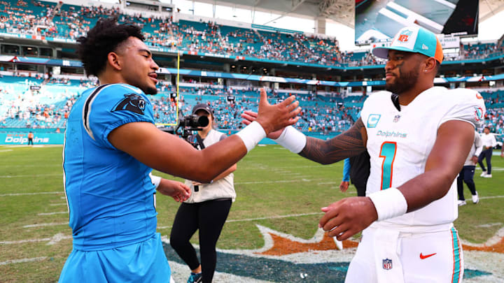MIAMI GARDENS, FLORIDA - OCTOBER 15: Bryce Young #9 of the Carolina Panthers and Tua Tagovailoa #1 of the Miami Dolphins embrace on the field after their game at Hard Rock Stadium on October 15, 2023 in Miami Gardens, Florida.