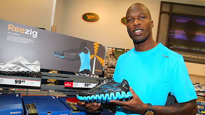 CARMEL, IN - MARCH 22: Chad Ochocinco surprises customers with Reebok ZigTech apparel at Dick's Sporting Goods on March 22, 2011 in Carmel, Indiana.