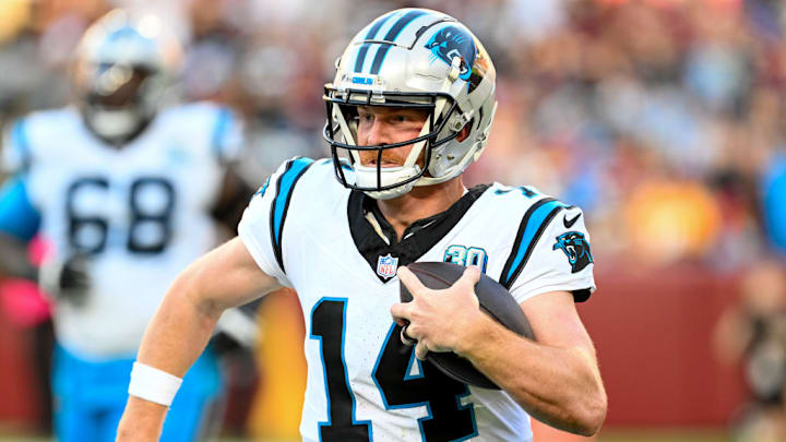 LANDOVER, MARYLAND - OCTOBER 20: Andy Dalton #14 of the Carolina Panthers runs the ball against the Washington Commanders during the second quarter at Northwest Stadium on October 20, 2024 in Landover, Maryland. LANDOVER, MARYLAND - OCTOBER 20: Andy Dalton #14 of the Carolina Panthers runs the ball against the Washington Commanders during the second quarter at Northwest Stadium on October 20, 2024 in Landover, Maryland.