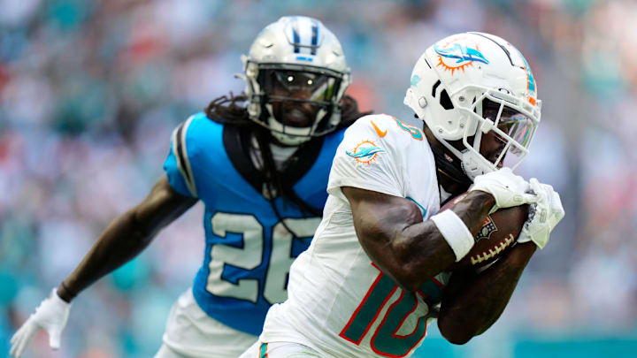 MIAMI GARDENS, FLORIDA - OCTOBER 15: Tyreek Hill #10 of the Miami Dolphins catches a pass for a touchdown during the second quarter in the game against the Carolina Panthers at Hard Rock Stadium on October 15, 2023 in Miami Gardens, Florida. MIAMI GARDENS, FLORIDA - OCTOBER 15: Tyreek Hill #10 of the Miami Dolphins catches a pass for a touchdown during the second quarter in the game against the Carolina Panthers at Hard Rock Stadium on October 15, 2023 in Miami Gardens, Florida.