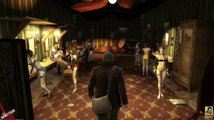 A man in a flat cap, jacket, and satchel in the dressing room of a burlesque club.