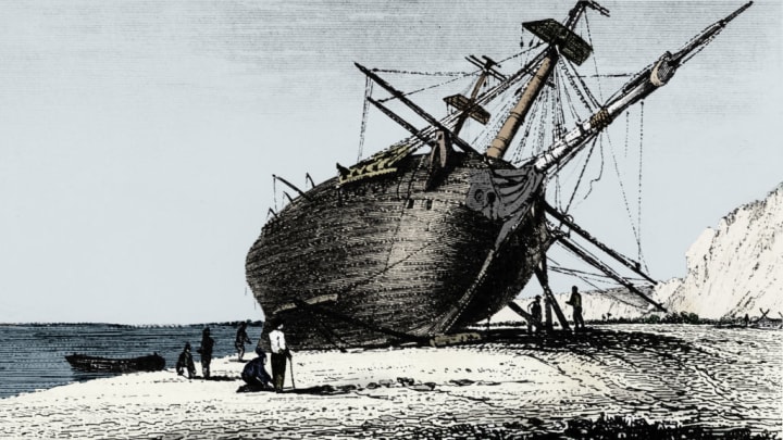 Picture of the HMS Beagle lying on the beach for repairs
