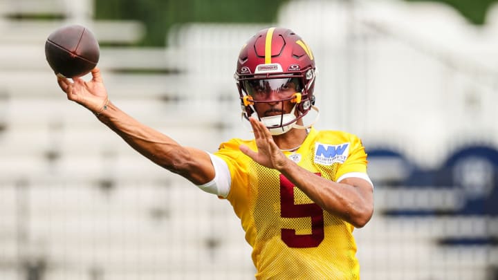 ASHBURN, VA - JULY 25: Jayden Daniels #5 of the Washington Commanders participates in a drill during training camp at OrthoVirginia Training Center at Commanders Park on July 25, 2024 in Ashburn, Virginia.