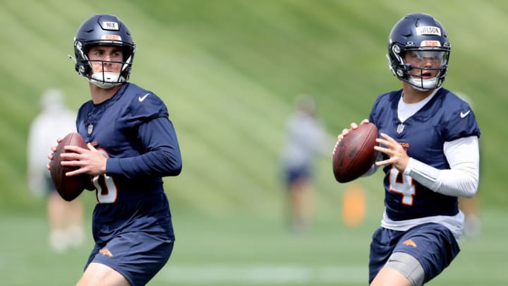 ENGLEWOOD, COLORADO - JUNE 04: Quarterbacks Bo NIx #10 and Zach Wilson #4 of the Denver Broncos throws during Denver Broncos OTA Offseason Workouts at Centura Health Training Center on June 04, 2024 in Englewood, Colorado.