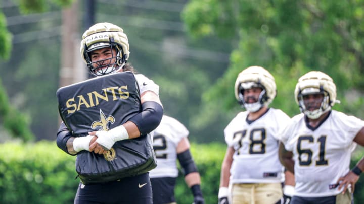 METAIRIE, LOUISIANA - MAY 28: Taliese Fuaga (75) of the New Orleans Saints attends OTA offseason workout at the New Orleans Saints Practice Facility on May 28, 2024 in Metaire, Louisiana. 