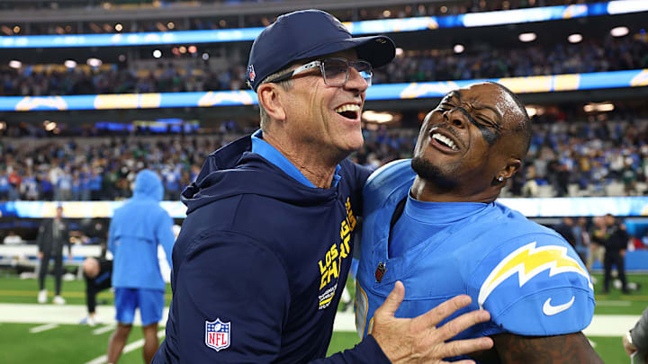 Chargers coach Jim Harbaugh celebrates with safety Tony Jefferson after an overtime win over the Eagles. Chargers coach Jim Harbaugh celebrates with safety Tony Jefferson after an overtime win over the Eagles.
