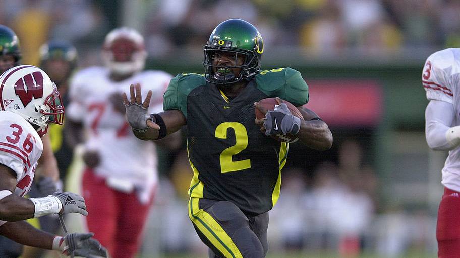 Onterrio Smith of the Oregon Ducks defends the ball against Mike Echols of the Wisconsin Badgers.
