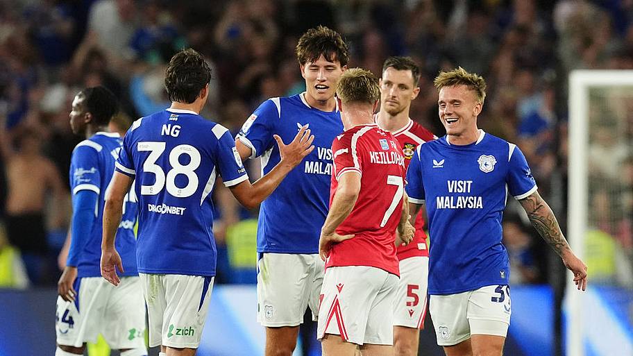 Rubin Colwill (centre) celebrates with team-mate Perry Ng after the final whistle.