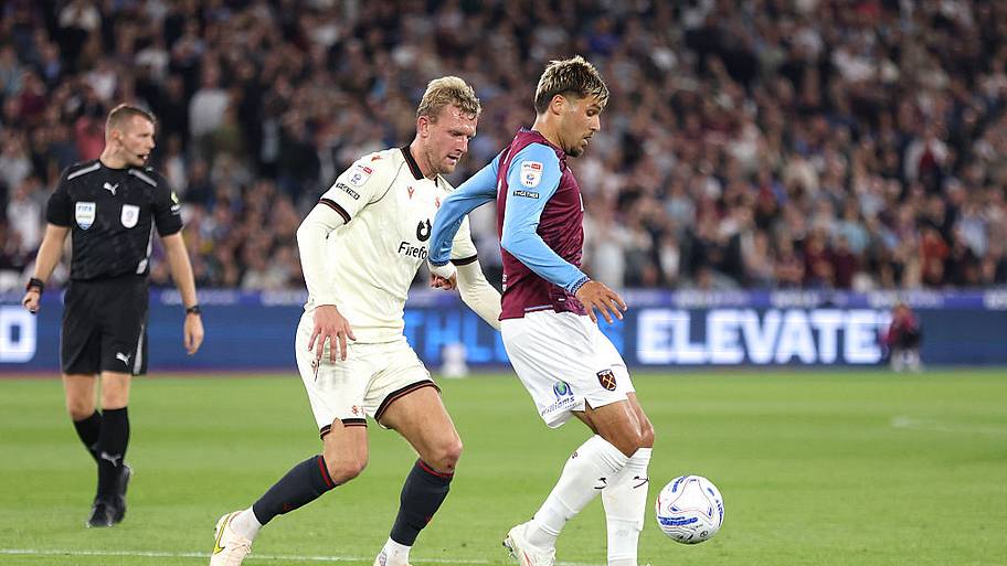 Joel Piroe and Wrexham's Joe Worrall during the Sky Bet Championship 2026/27 match between West Ham United and Wrexham.