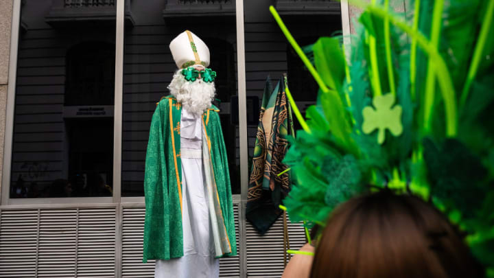 A man dressed as Saint Patrick during the celebration of...