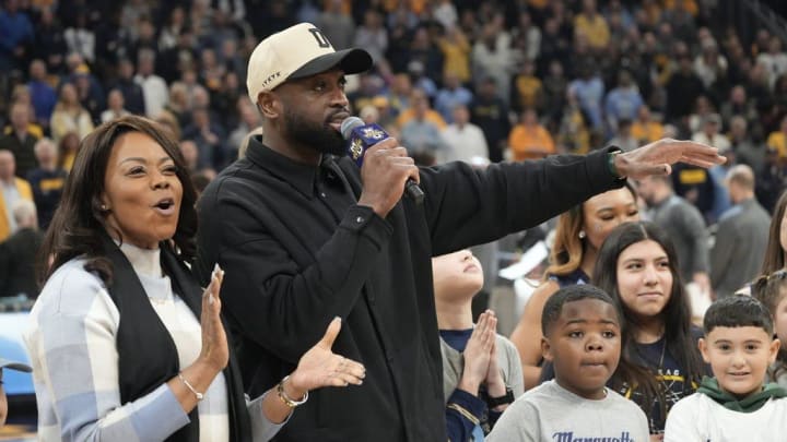 Basketball Hall of Famer Dwyane Wade talks to the crowd after it was announced that he is giving $3 million to Marquette.