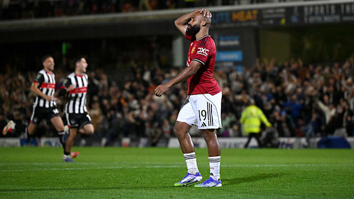 Bryan Mbeumo reacts after missing the decisive penalty in the shootout.