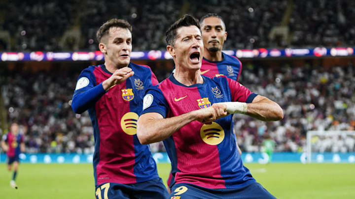 Barcelona's Polish player Robert Lewandowski celebrates...