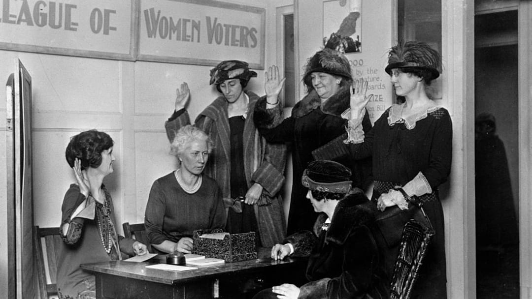 Women register to vote following the ratification of the 19th Amendment.