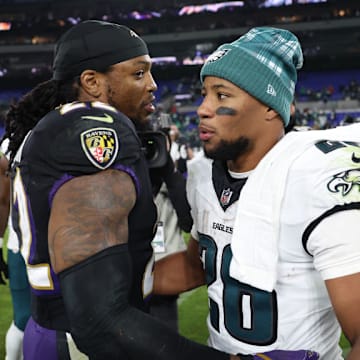 Philadelphia Eagles' Saquon Barkley and Baltimore Ravens' Derrick Henry on December 1, 2024.