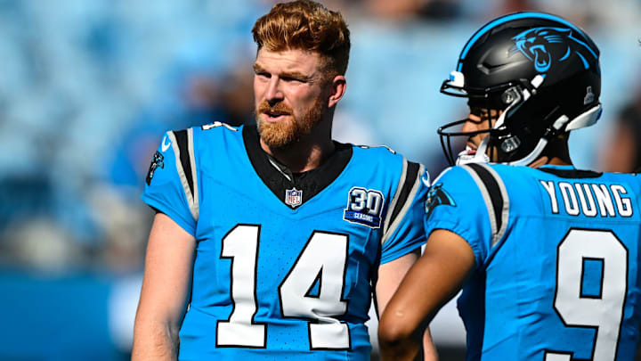 CHARLOTTE, NORTH CAROLINA - OCTOBER 13: Andy Dalton #14 of the Carolina Panthers and teammate Bryce Young #9) speak prior to their game against the Atlanta Falcons at Bank of America Stadium on October 13, 2024 in Charlotte, North Carolina. CHARLOTTE, NORTH CAROLINA - OCTOBER 13: Andy Dalton #14 of the Carolina Panthers and teammate Bryce Young #9) speak prior to their game against the Atlanta Falcons at Bank of America Stadium on October 13, 2024 in Charlotte, North Carolina.