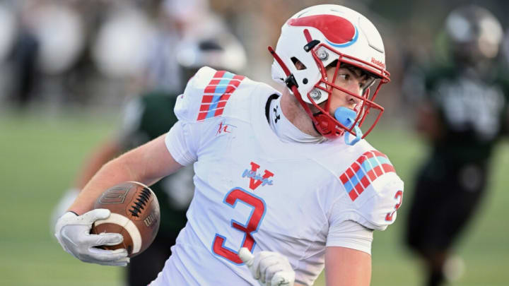 Brian Kortovich of Villa Angela-St. Joseph runs with the ball after making a catch against GlenOak on August 23, 2024. 