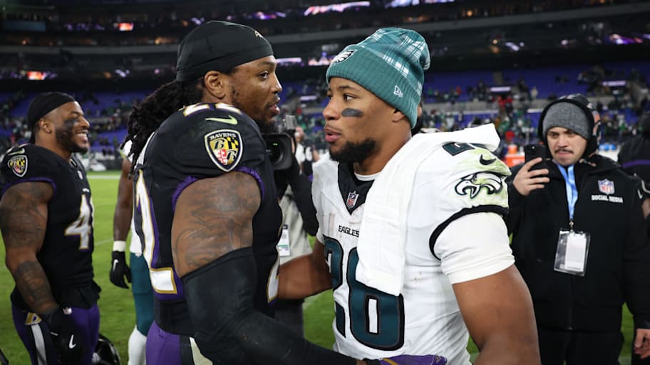 Philadelphia Eagles' Saquon Barkley and Baltimore Ravens' Derrick Henry on December 1, 2024. | Patrick Smith/Getty Images