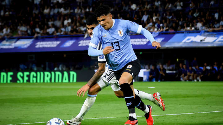 Cristian Romero of Argentina (BC) and Maximiliano Araujo of...