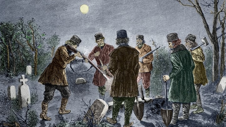 Men prevent a vampire rising from its grave in a Romanian cemetery in this 19th-century illustration.