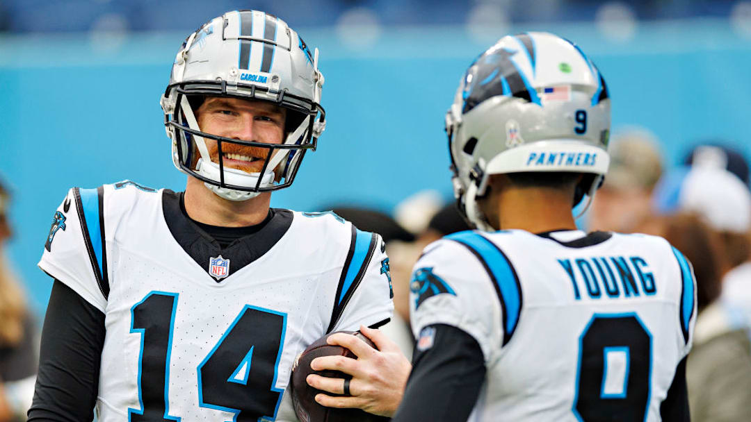 NASHVILLE, TENNESSEE - NOVEMBER 26: Andy Dalton #14 and Bryce Young #9 of the Carolina Panthers warm up before the game against the Tennessee Titans at Nissan Stadium on November 26, 2023 in Nashville, Tennessee. The Titans defeated the Panthers 17-10.