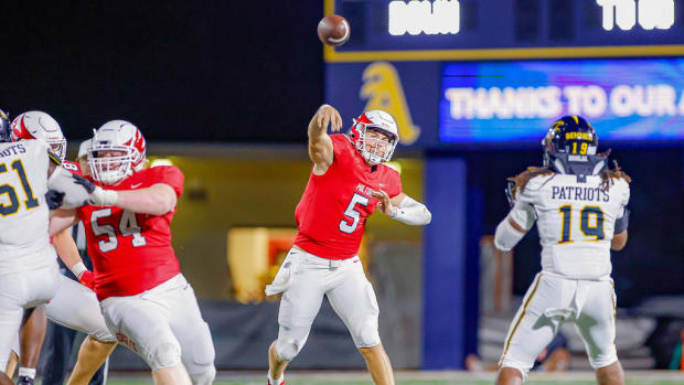 Milton quarterback Luke Nickel throwing against American Heritage 