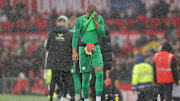 A dejected Robert Sánchez heads down the tunnel after a fifth-minute red card.