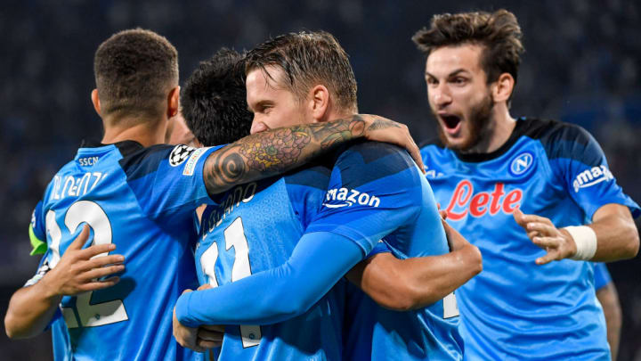 Hirving Lozano of SSC Napoli (2l) celebrates with Piotr...