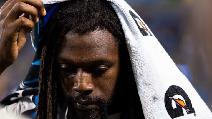 CHARLOTTE, NORTH CAROLINA - AUGUST 17: Jadeveon Clowney #7 of the Carolina Panthers stands on the sideline with a Gatorade towel on his head during a preseason game against the New York Jets at Bank of America Stadium on August 17, 2024 in Charlotte, North Carolina.