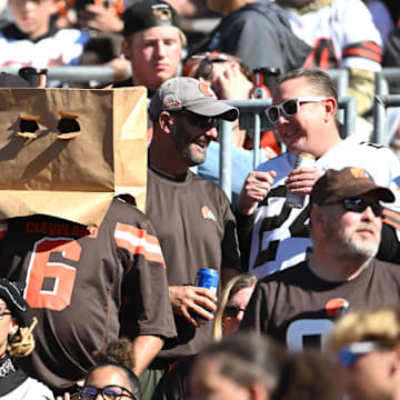 A Cleveland Browns fan wears a bag on his head during a game on October 20, 2024. 